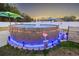 Backyard pool area decorated with festive lighting and tiki decor, perfect for summer fun at 304 Carolina Springs Ct., Conway, SC 29527