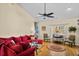 Comfortable living room with ample seating, a vaulted ceiling, hardwood floors, and natural light at 3079 Alice Ln., Little River, SC 29566