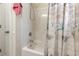 Bright bathroom shower with floral shower curtain and a shower head at 321 Cabo Loop, Myrtle Beach, SC 29588