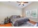 Cozy bedroom with a ceiling fan, a large window, and neutral decor at 321 Cabo Loop, Myrtle Beach, SC 29588