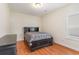 Bedroom with black wood furniture and wood floors at 321 Cabo Loop, Myrtle Beach, SC 29588