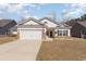Charming single-Gathering home with a well-maintained lawn, garage, and inviting curb appeal at 321 Cabo Loop, Myrtle Beach, SC 29588