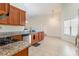 Functional kitchen featuring granite countertops, stainless appliances, and tile flooring at 321 Cabo Loop, Myrtle Beach, SC 29588