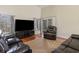 Comfortable living room with plush leather seating, a large TV, and natural light at 321 Cabo Loop, Myrtle Beach, SC 29588