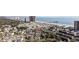 Expansive aerial view of the condo buildings near the beach, pier, and other businesses at 351 Lake Arrowhead Rd. # 131, Myrtle Beach, SC 29572