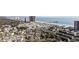 Expansive aerial view of the condo buildings near the beach, pier, and other businesses at 351 Lake Arrowhead Rd. # 131, Myrtle Beach, SC 29572