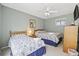 Cozy bedroom featuring two beds, a ceiling fan, and a view of the outside at 351 Lake Arrowhead Rd. # 131, Myrtle Beach, SC 29572