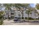 Attractive three story condo building with covered entry, landscaping, and reserved parking at 351 Lake Arrowhead Rd. # 131, Myrtle Beach, SC 29572