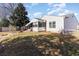 Exterior view of a charming white home with a screened-in porch and a well-maintained backyard at 356 Boxcar Dr., Longs, SC 29568