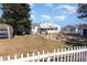 Spacious backyard featuring a patio, fire pit, and white picket fence, perfect for outdoor entertaining at 356 Boxcar Dr., Longs, SC 29568