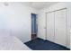 This bedroom features a closet with bifold doors and blue carpet at 356 Boxcar Dr., Longs, SC 29568