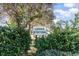 Community entrance sign amidst lush greenery indicating 'Longs Station', at 356 Boxcar Dr., Longs, SC 29568