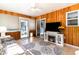 This sun room features wood paneling and a fireplace at 356 Boxcar Dr., Longs, SC 29568