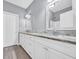Bathroom featuring white cabinetry, a double sink vanity with granite countertops, and modern fixtures at 3837 Mayfield Dr., Conway, SC 29526