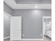 Hallway that leads to the bathroom featuring white doors and gray walls at 3837 Mayfield Dr., Conway, SC 29526