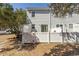 Spacious backyard featuring a privacy fence, and mature trees to enjoy the outdoors at 4115 Little River Rd. # 4-F, Myrtle Beach, SC 29577