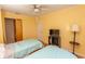Bright bedroom with hardwood floors, ceiling fan and two twin beds at 4115 Little River Rd. # 4-F, Myrtle Beach, SC 29577