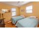 Charming bedroom with hardwood floors, natural lighting and twin beds at 4115 Little River Rd. # 4-F, Myrtle Beach, SC 29577