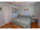 Cozy bedroom featuring wood floors, soft natural light, and closet at 4115 Little River Rd. # 4-F, Myrtle Beach, SC 29577