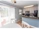 Bright kitchen featuring white cabinets, stainless steel appliances and breakfast nook with sliding door access to the outside at 4115 Little River Rd. # 4-F, Myrtle Beach, SC 29577