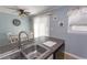 Functional kitchen area with granite countertops and a view to a dinette at 4115 Little River Rd. # 4-F, Myrtle Beach, SC 29577