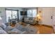 Cozy living room with hardwood floors, stylish furniture, and natural light creating a warm and inviting atmosphere at 4115 Little River Rd. # 4-F, Myrtle Beach, SC 29577