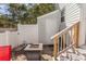 Side view of patio with outdoor fire pit and easy access to side door and stairs at 4115 Little River Rd. # 4-F, Myrtle Beach, SC 29577