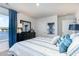 Bright bedroom with water view from the window, striped bedding, and dark dresser at 543 Firouz Dr, Longs, SC 29568