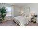 Bright bedroom with a large window offering a scenic view of the lake at 6007 Forest Dell Ct, Myrtle Beach, SC 29579