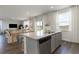 Kitchen island with stainless steel appliances and granite countertops, open to dining and living areas at 6007 Forest Dell Ct, Myrtle Beach, SC 29579