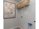 Functional laundry room with shelving and hookups, offering convenience and organization for laundry tasks at 6007 Forest Dell Ct, Myrtle Beach, SC 29579