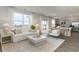 Open-concept living room with views of the water, neutral decor, and comfortable seating, and access to kitchen at 6007 Forest Dell Ct, Myrtle Beach, SC 29579