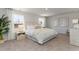Serene main bedroom with large windows, soft lighting, and plush bedding for ultimate comfort at 6007 Forest Dell Ct, Myrtle Beach, SC 29579