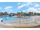 Community pool with multiple areas, fountains and seating under a blue sky at 6007 Forest Dell Ct, Myrtle Beach, SC 29579