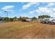 Community recreational area featuring open field and vehicle storage at 6007 Forest Dell Ct, Myrtle Beach, SC 29579
