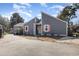 Gray two-story house with well-kept landscaping and a paved driveway at 617 Rosemary Ln., North Myrtle Beach, SC 29582