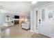 Bright living room with fireplace, white couches, and lovely natural light coming through the front door at 617 Rosemary Ln., North Myrtle Beach, SC 29582