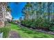 Serene backyard featuring a stream, well-manicured lawn, and lush landscaping at 6253 Catalina Dr. # 1711, North Myrtle Beach, SC 29582