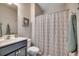 Bright bathroom featuring a vanity, a patterned shower curtain, and ample storage at 6253 Catalina Dr. # 1711, North Myrtle Beach, SC 29582