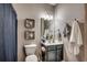 Neat bathroom featuring a vanity, seashell decorations, and a well-lit mirror at 6253 Catalina Dr. # 1711, North Myrtle Beach, SC 29582