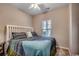 Bright bedroom featuring a comfy bed, neutral walls, and large window for natural light at 6253 Catalina Dr. # 1711, North Myrtle Beach, SC 29582
