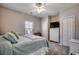 Well-lit bedroom with closet, dresser, ceiling fan, and ample sunlight for a cozy atmosphere at 6253 Catalina Dr. # 1711, North Myrtle Beach, SC 29582