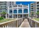 Building exterior with a bridge walkway featuring multiple decks and beach access at 6253 Catalina Dr. # 1711, North Myrtle Beach, SC 29582