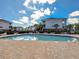 Community pool area with pool, lounge chairs and palm trees, perfect for relaxation and recreation at 6253 Catalina Dr. # 1711, North Myrtle Beach, SC 29582