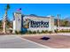 Welcoming entrance sign for Barefoot Resort & Golf, adorned with the American flag at 6253 Catalina Dr. # 1711, North Myrtle Beach, SC 29582