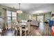 Living room with hardwood floors, view of dining room, and sliding glass doors at 6253 Catalina Dr. # 1711, North Myrtle Beach, SC 29582