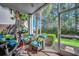 Enjoy outdoor living on this screened porch, featuring comfortable seating and views of the lush greenery at 6253 Catalina Dr. # 1711, North Myrtle Beach, SC 29582