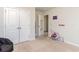 Cozy bedroom with a closet, neutral walls, carpet flooring, and natural light from the entry at 723 Joywood Dr., Longs, SC 29568