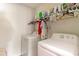 Efficient laundry room featuring a washer, dryer, and overhead shelving for storage and organization at 723 Joywood Dr., Longs, SC 29568
