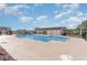 Community pool offers a large swimming area, a covered pavilion, a playground, and ample seating at 723 Joywood Dr., Longs, SC 29568